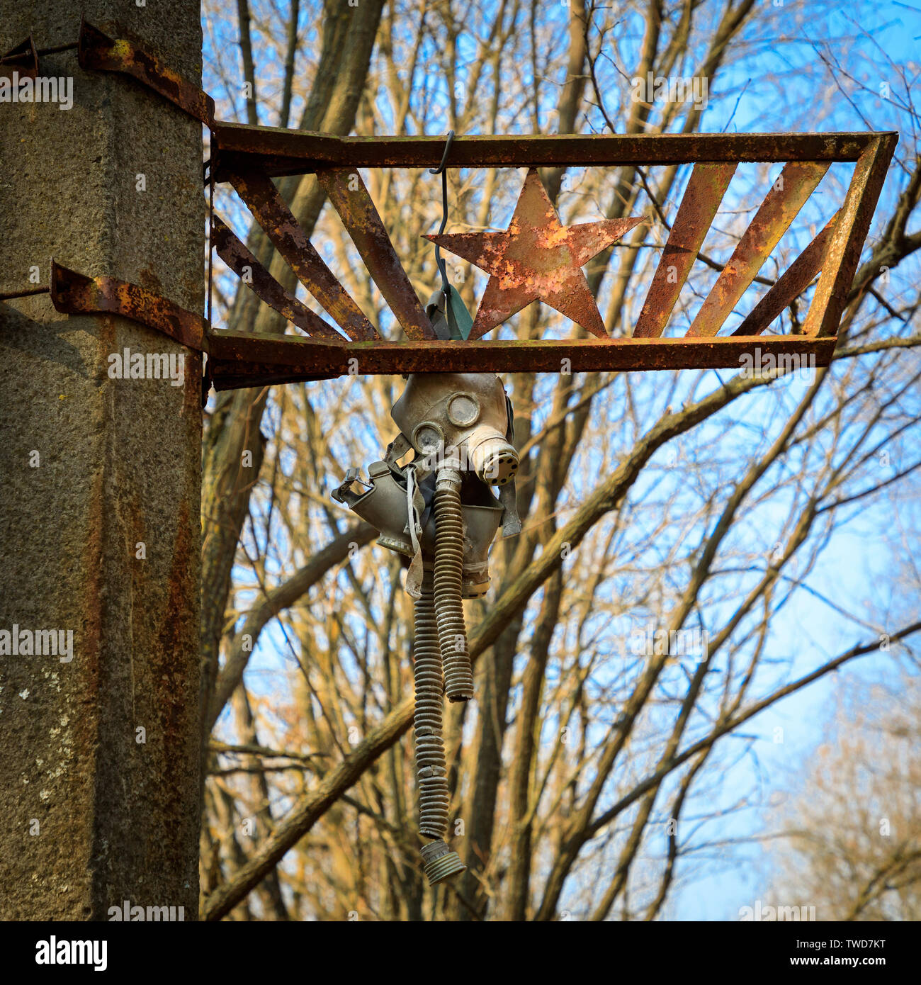 Eastern Europe, Ukraine, Pripyat, Chernobyl. Gas masks hanging from street sign. Stock Photo