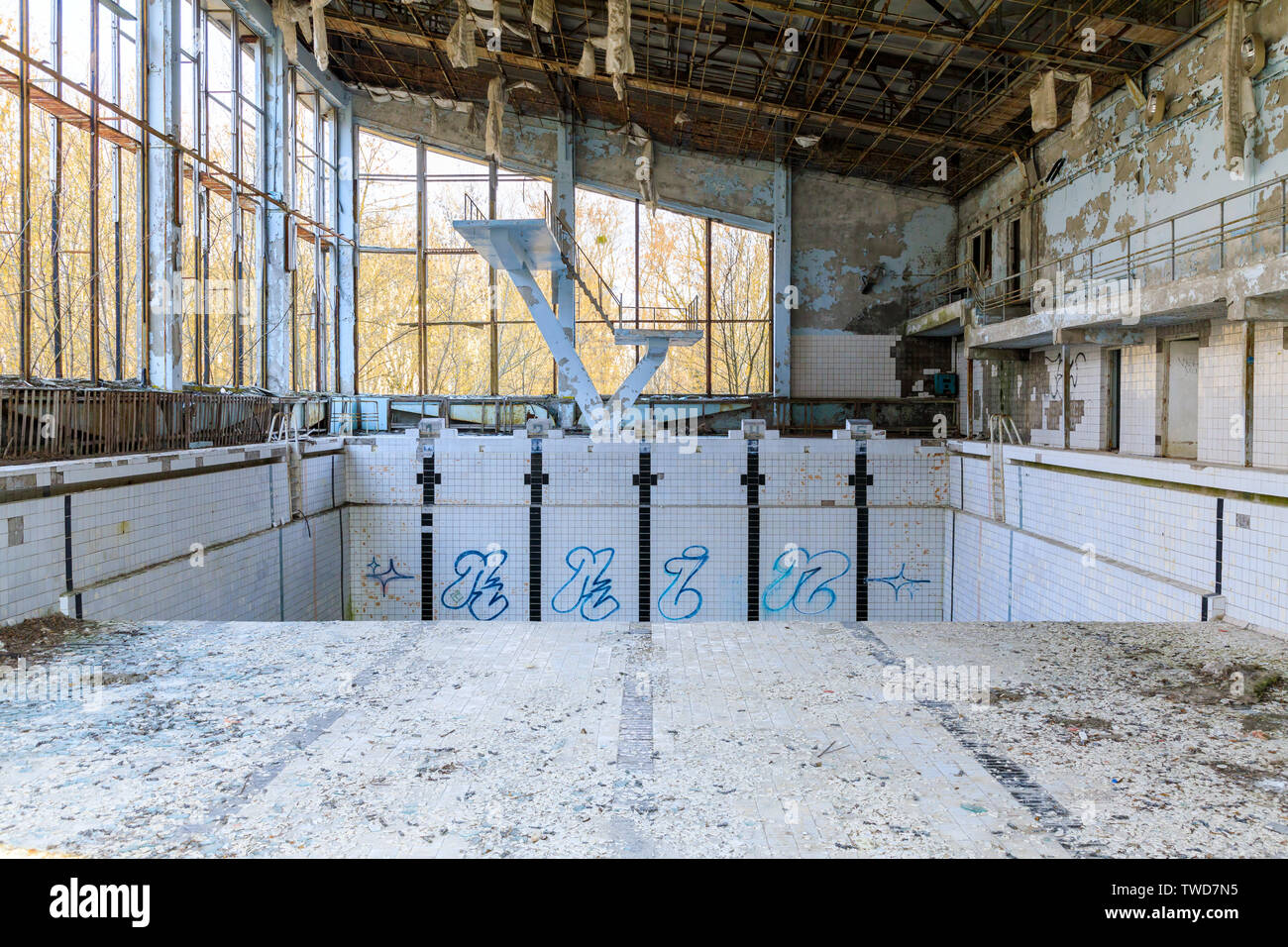 Eastern Europe, Ukraine, Pripyat, Chernobyl. Sports court, Azure swimming pool. Diving board. April 11, 2018. Stock Photo