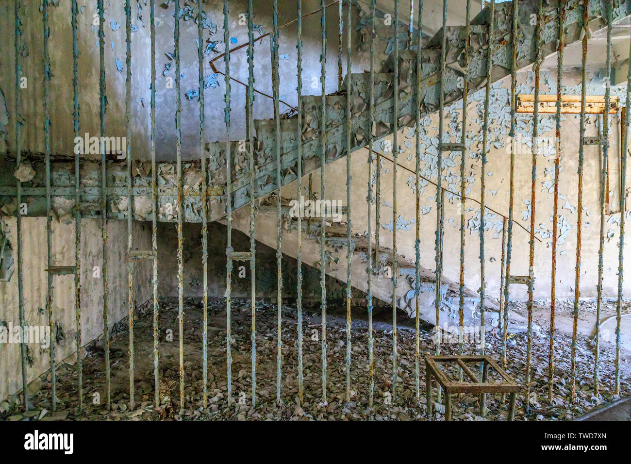Eastern Europe, Ukraine, Pripyat, Chernobyl. Stair case, peeling paint on walls. Stock Photo