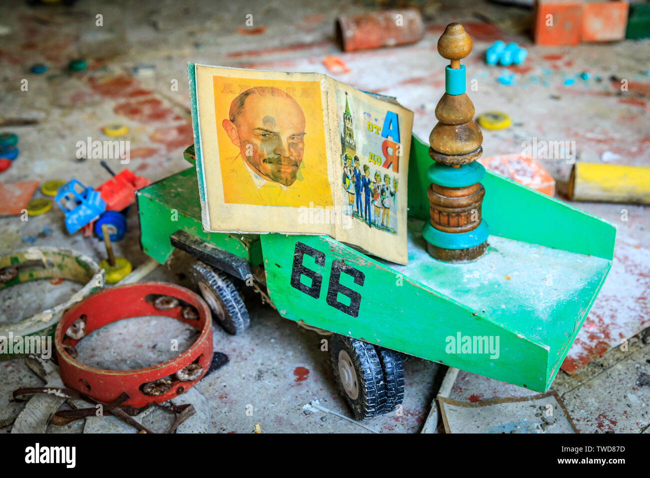 Eastern Europe, Ukraine, Pripyat, Chernobyl. Toys in the kindergarten. Children's book with picture of Lenin sits in a dumptruck. April 11, 2018. Stock Photo