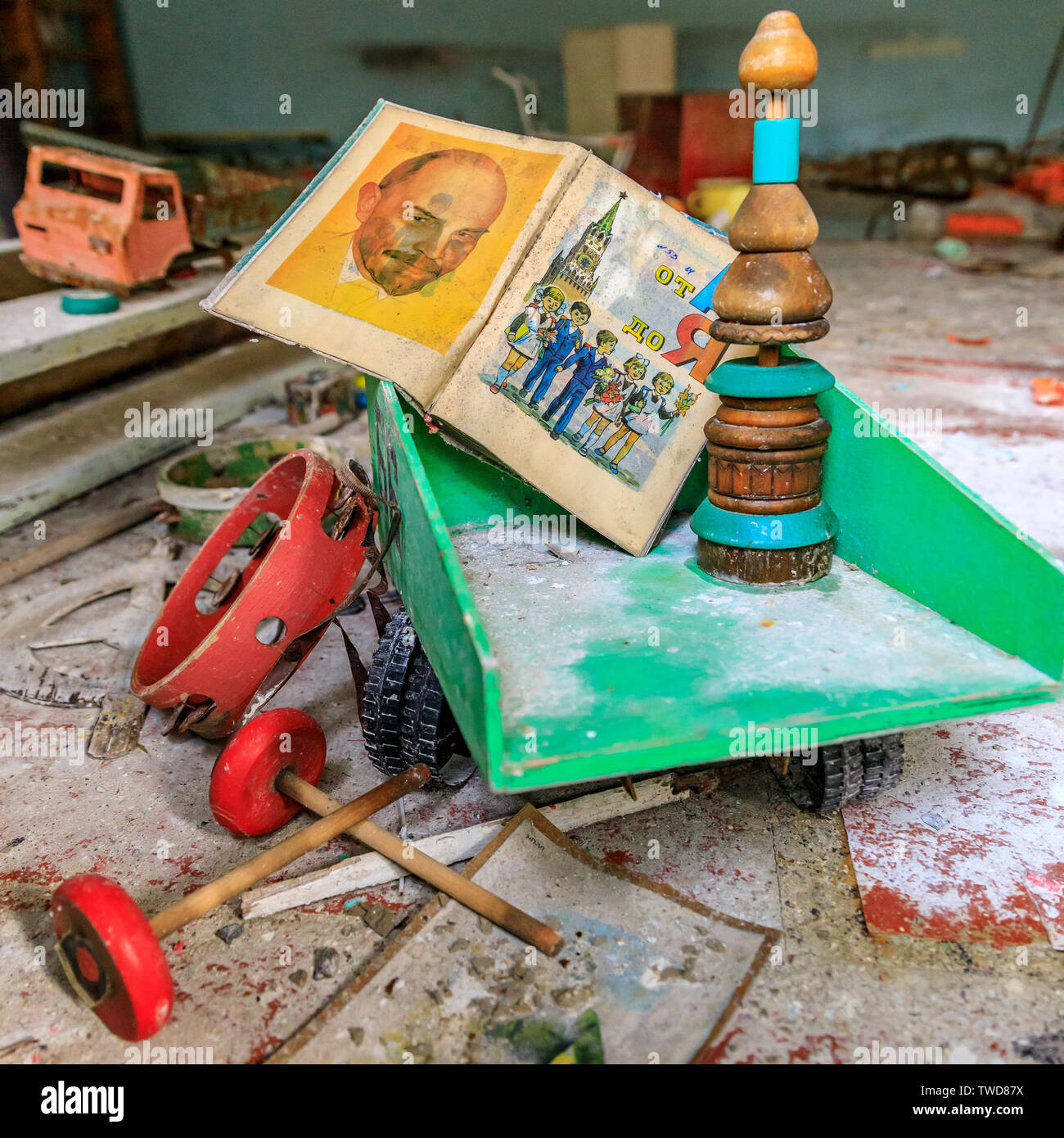 Eastern Europe, Ukraine, Pripyat, Chernobyl. Toys in the kindergarten. Children's book with picture of Lenin sits in a dumptruck. April 11, 2018. Stock Photo