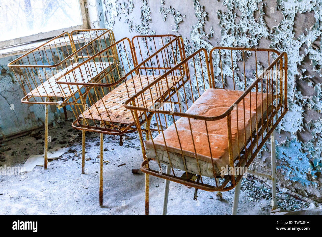 Eastern Europe, Ukraine, Pripyat, Chernobyl. The Hospital MsCh-126 (medical-sanitary unit). Infant beds in maternity area. Stock Photo