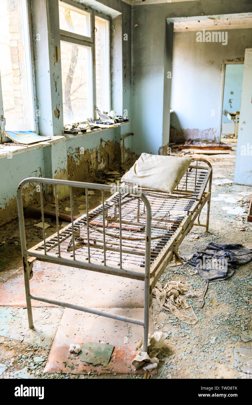 Eastern Europe, Ukraine, Pripyat, Chernobyl. The Hospital MsCh-126 (medical-sanitary unit). Bed. Stock Photo