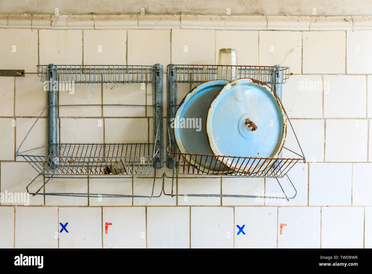 Eastern Europe, Ukraine, Pripyat, Chernobyl. The Hospital MsCh-126 (medical-sanitary unit). Pot lids on a wall rack in the kitchen. Stock Photo
