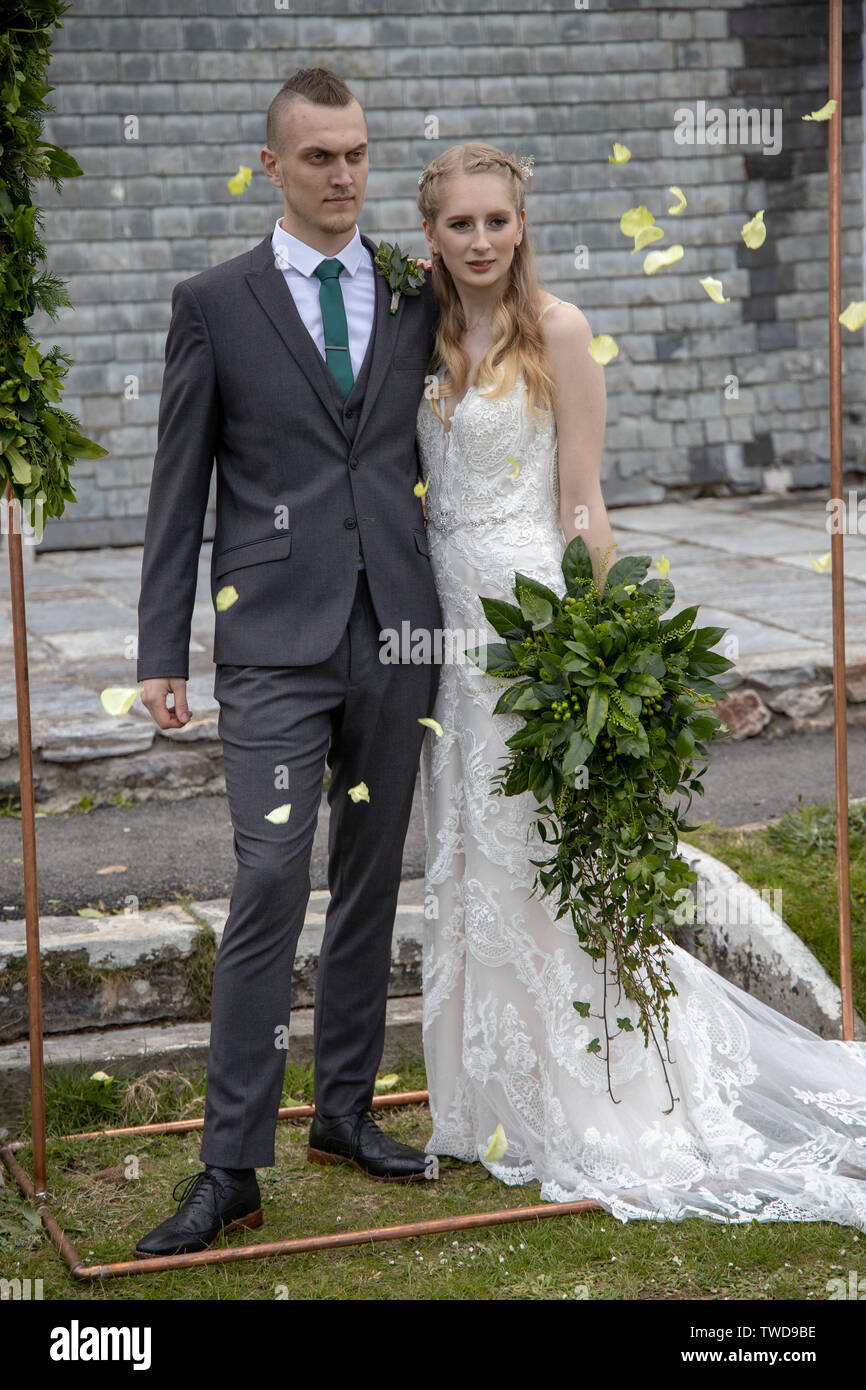 Couple showered with Wedding confetti, Jennycliff, Plymouth, Devon, UK