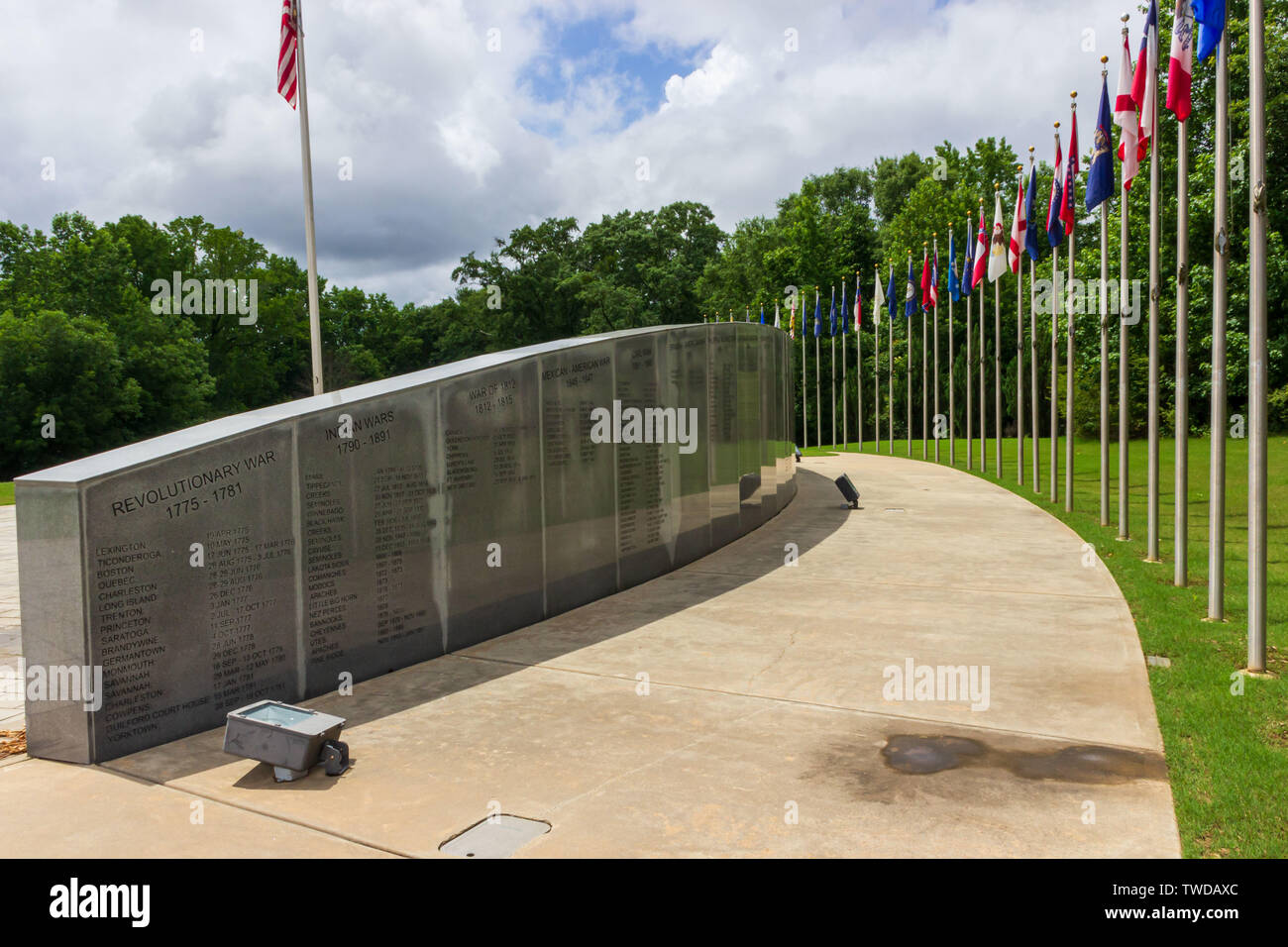 McDonough, Georgia / USA - June 9, 2019: A view of the Veterans' Wall of Honor lined with state flags in Heritage Park. Stock Photo