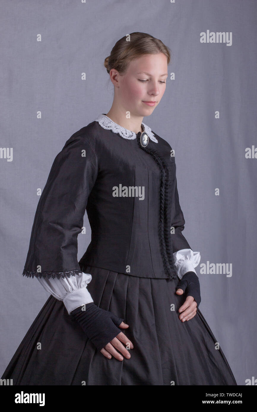 Young Victorian woman in black ensemble Stock Photo
