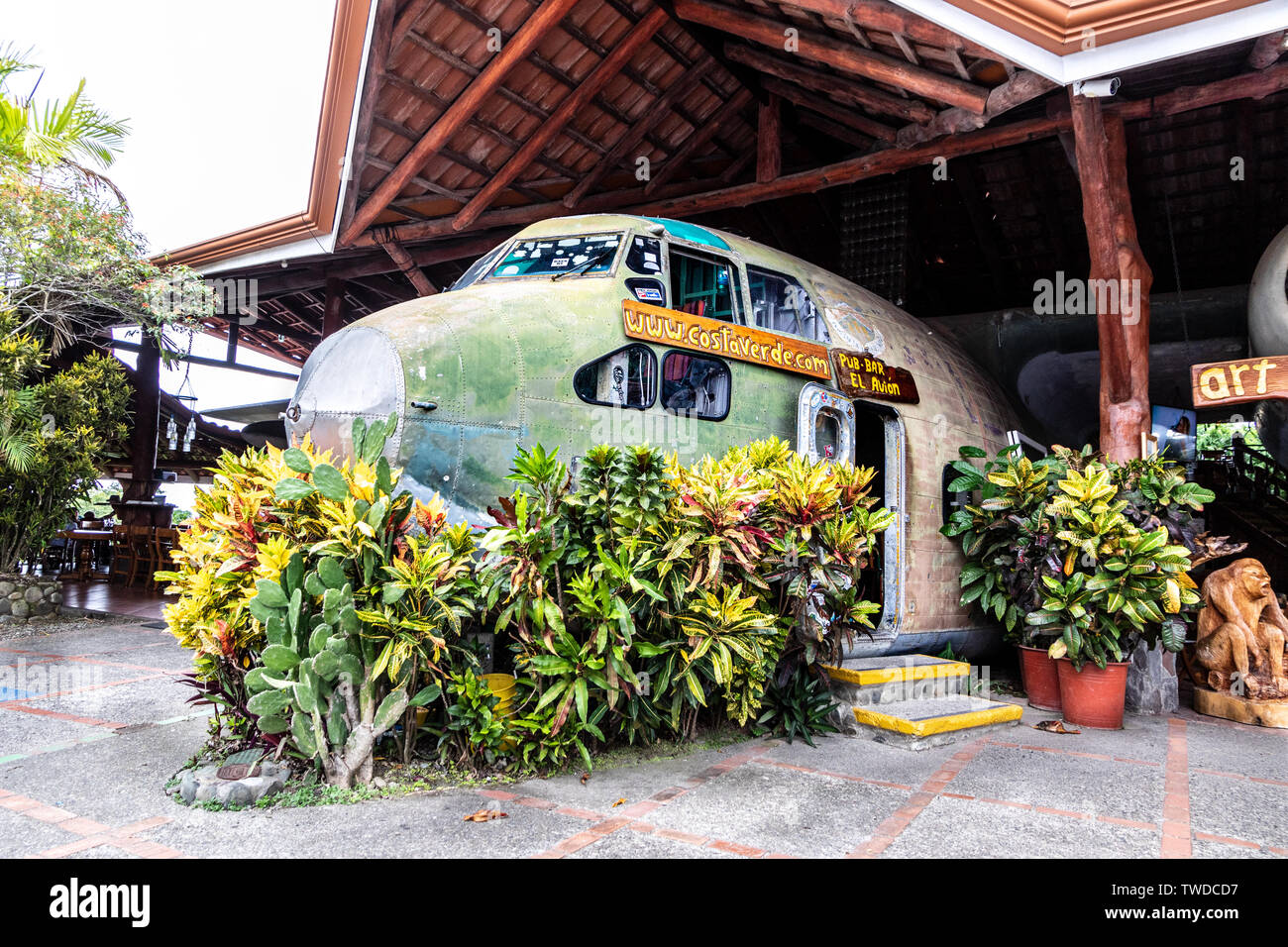El Avión, in Manuel Antonio, is a popular bar and restaurant in Costa Rica. The centerpiece of the restaurant is a hollowed out C-123 cargo plane. Stock Photo