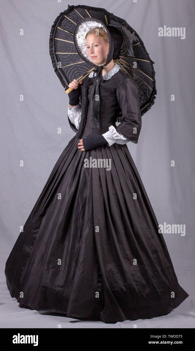 Young Victorian woman in black ensemble Stock Photo