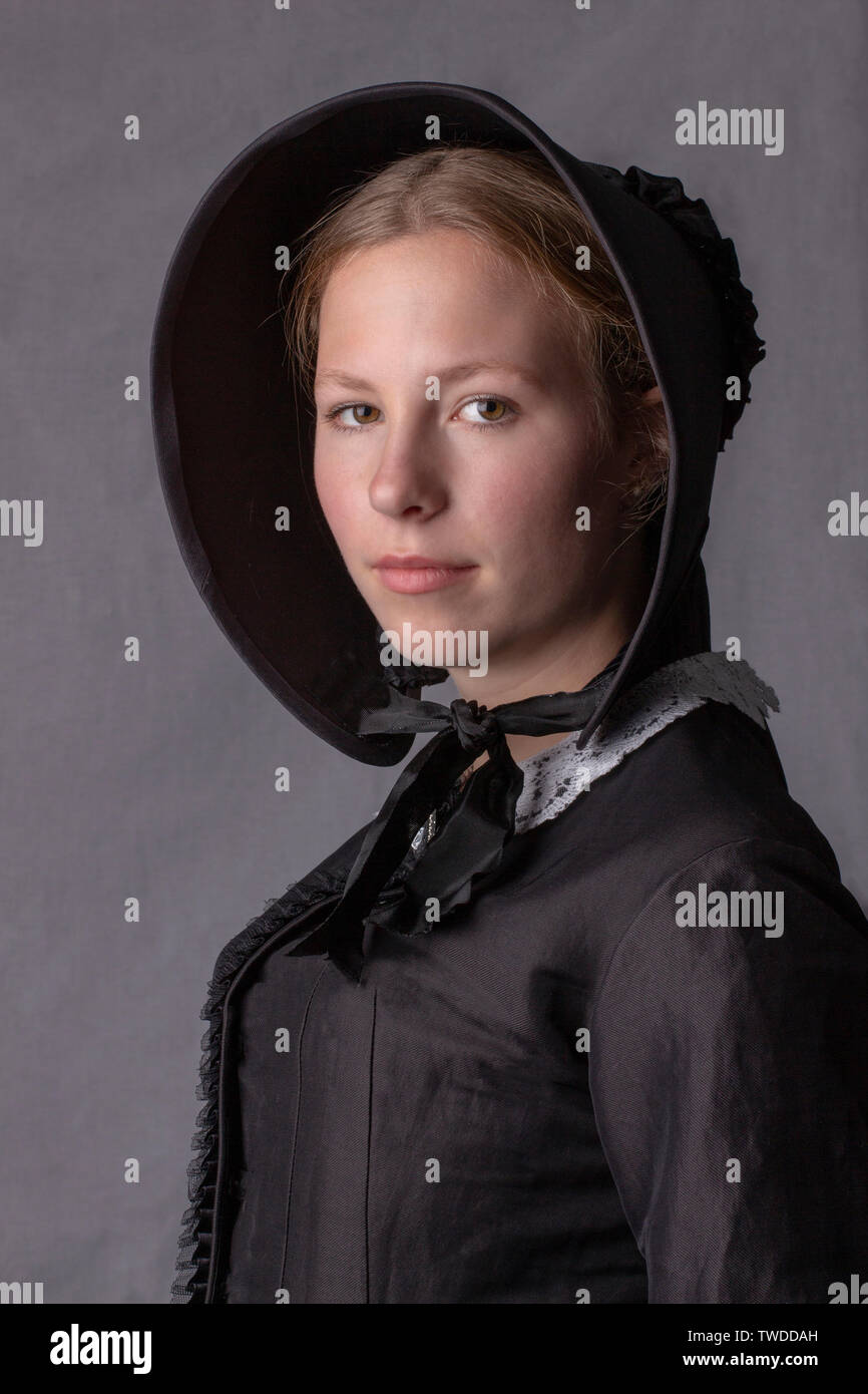Young Victorian woman in black ensemble Stock Photo