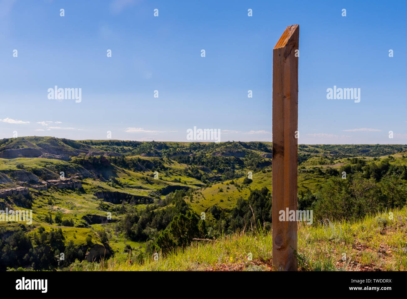 Wooden Post Trail Marker Overlooking Valley in Badlands Stock Photo Alamy