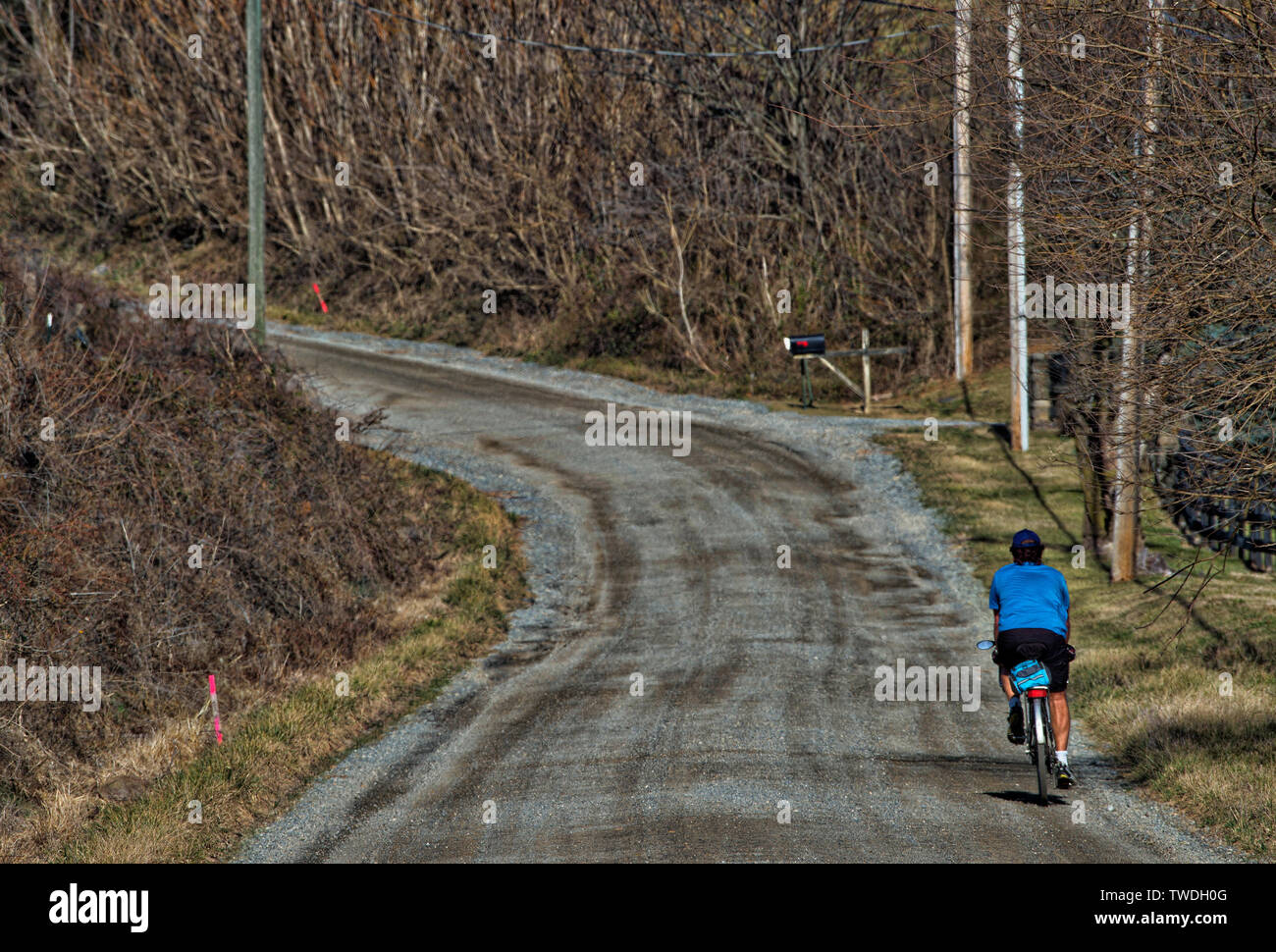 UNITED STATES - 02-20-2017: A cyclist enjoys a warm Presidents Day holiday with a ride along Williams Gap Road near Bluemont in Western Loudoun County Stock Photo