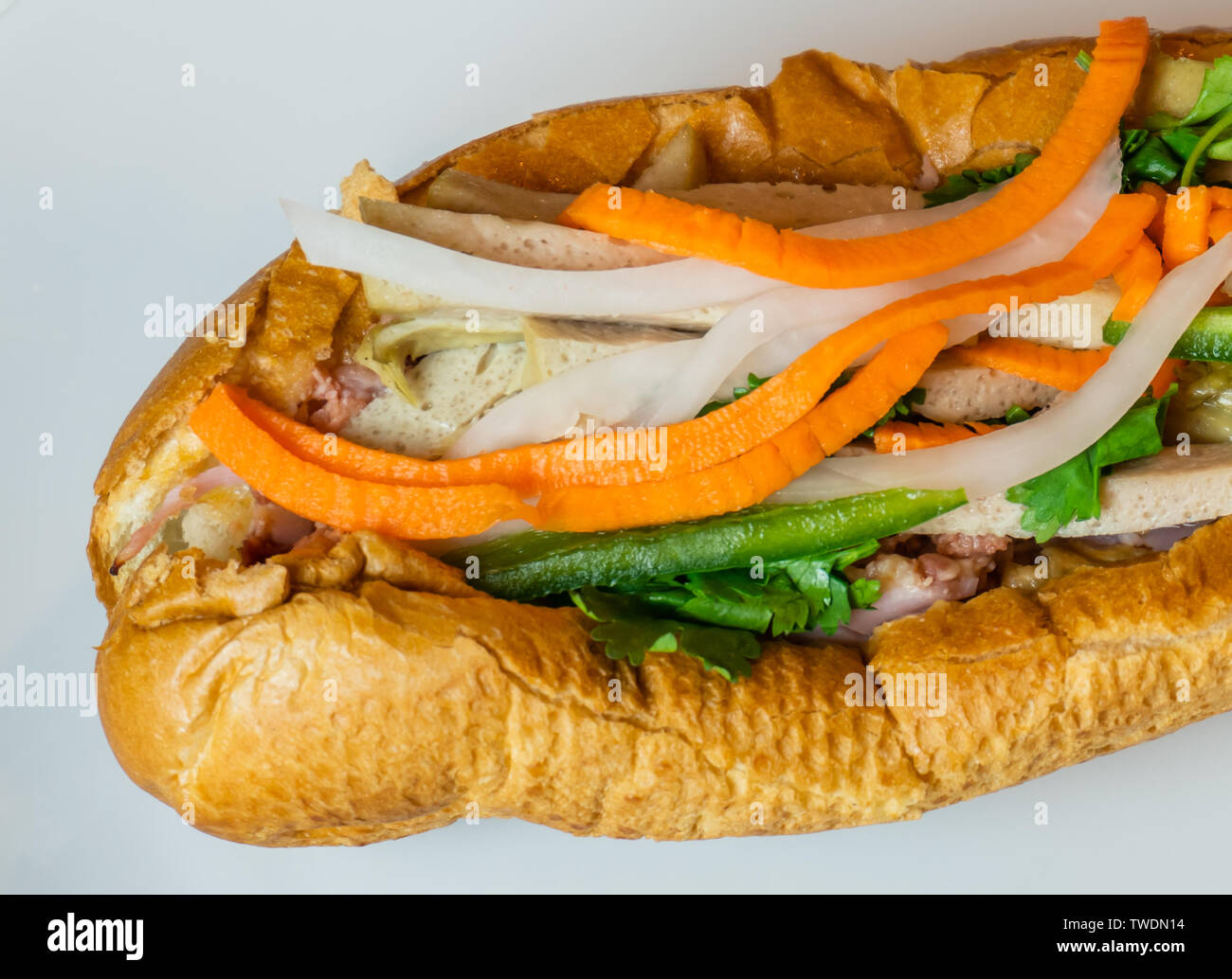 Close up shot of a traditional Banh Mi Sandwich. Banh Mi Sandwiches came from the influence of the French colonization in the mid 19th century. Stock Photo
