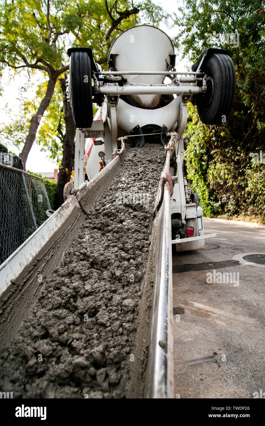 Pouring concrete from a concrete truck Stock Photo Alamy