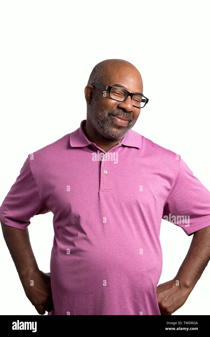 Portrait of a Cheerful smiling African American with big belly and goofy face, purple shirt and black glasses on  white isolated background with eyes Stock Photo