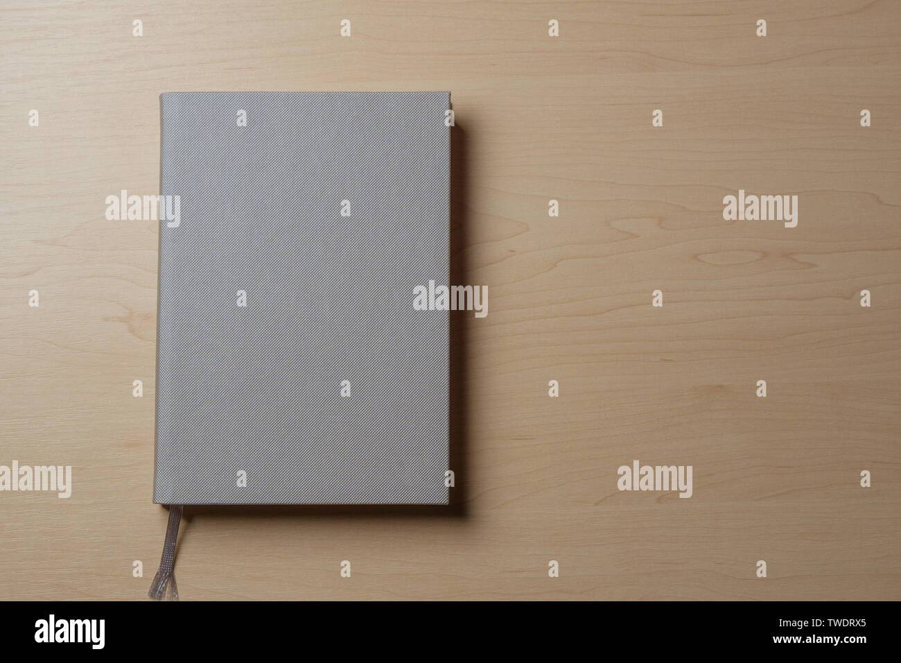 Silver diary on a light table. Stock Photo