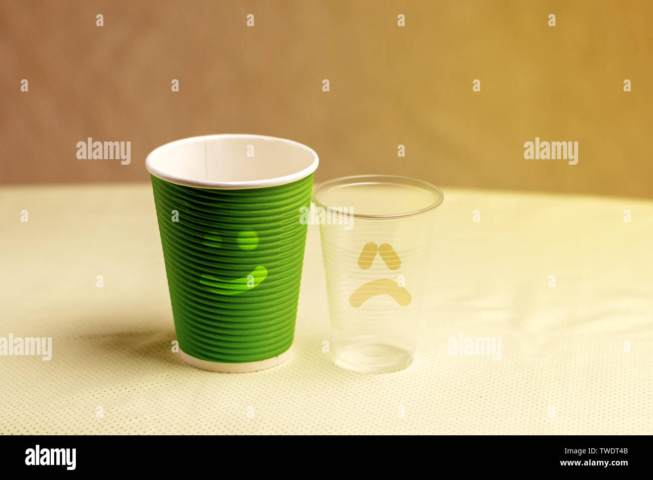 Green paper cup and plastic cup with smiles Stock Photo Alamy