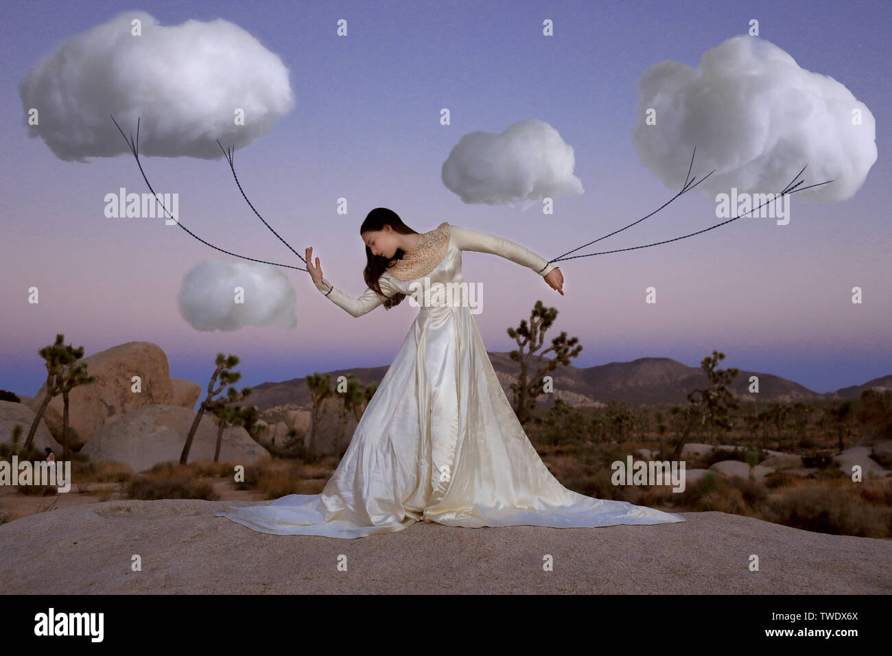 Creative Concept of Girl Attached to Clouds Representing Fantasy Stock Photo