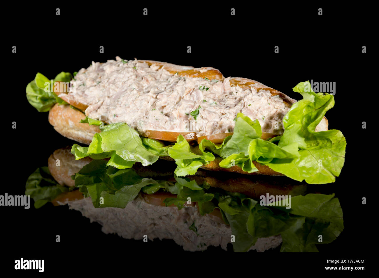 TUNA MAYO BAGUETTE with reflection isolated on black background. Studio