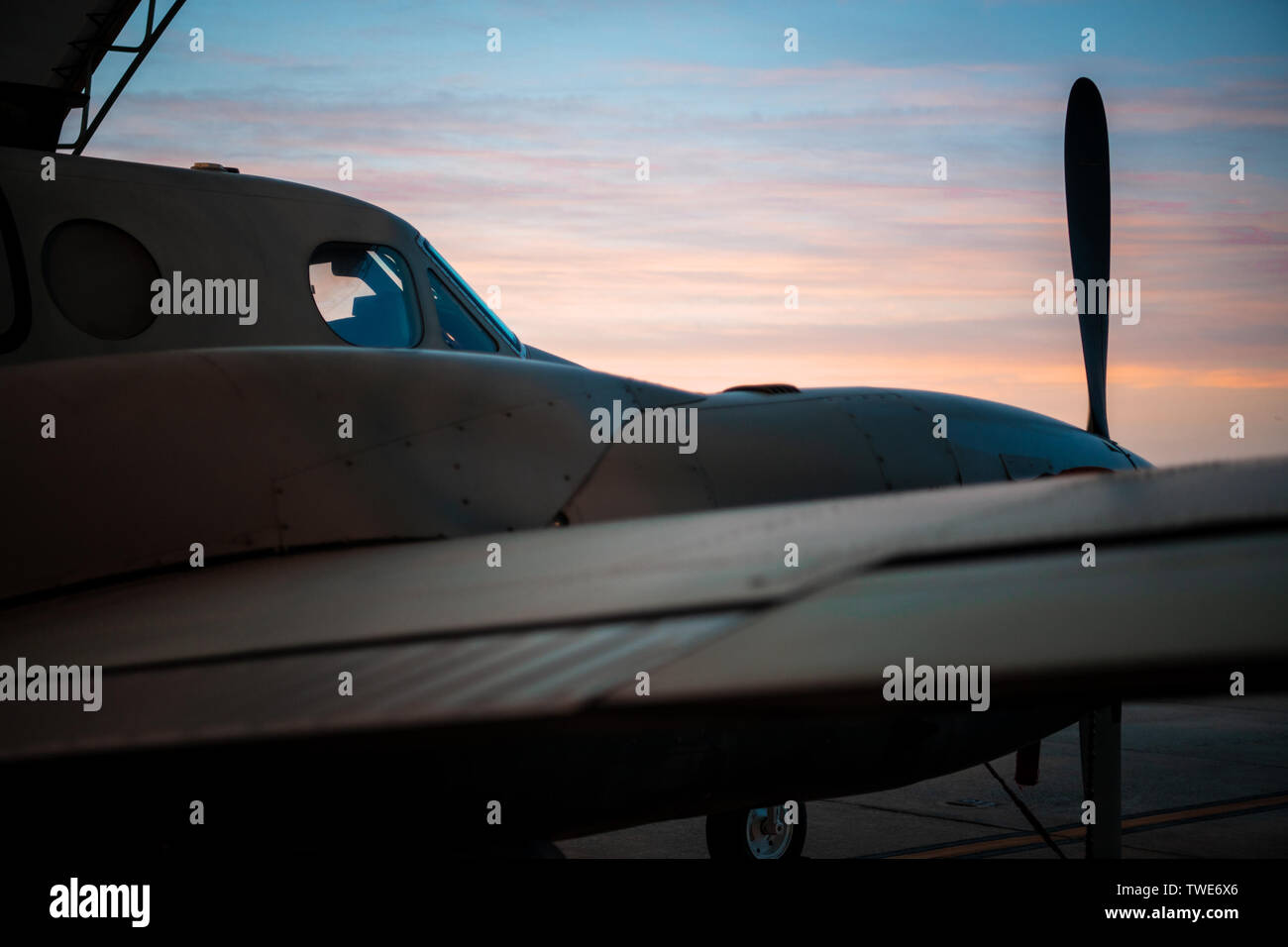 A 137th Special Operations Wing MC-12W awaits an early morning preflight inspection at Will Rogers Air National Guard Base in Oklahoma City, May 22, 2018. The MC-12 is a twin-engine turbo prop aircraft used to gather intelligence, surveillance and reconnaissance to support ground forces around the world. (U.S. Air National Guard photo by Senior Airman Jordan Martin) Stock Photo