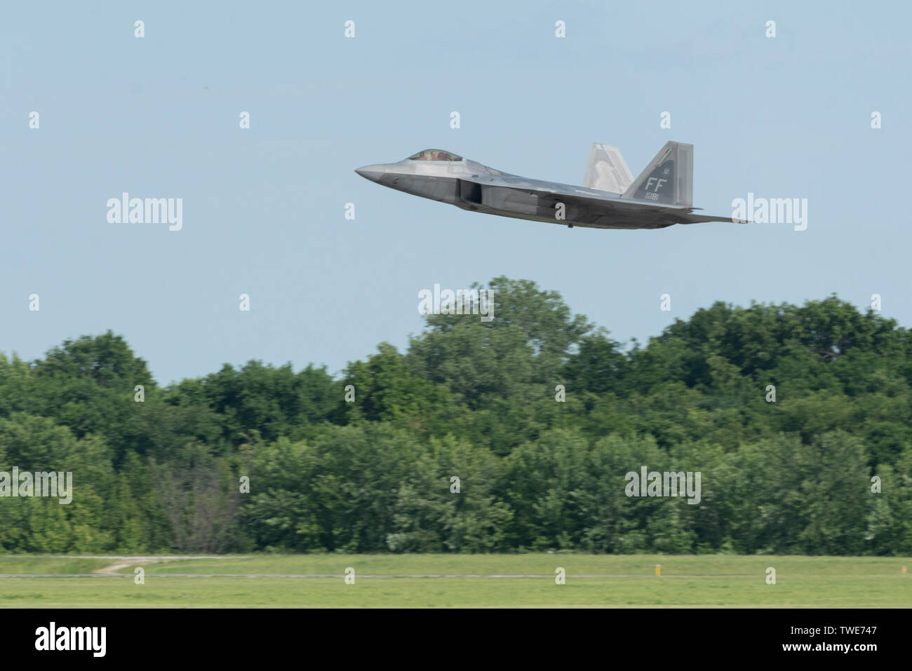 U.S. Air Force Maj. Paul 'Loco' Lopez, F-22 Demo Team commander/pilot, performs a touch-and-go before landing at Whiteman Air Force Base, Mo. for the Wings Over Whiteman Air Show, June 15, 2019. Celebrating the 30th anniversary of the B-2 Spirit, the show brought in over 120,000 spectators throughout the weekend. (U.S. Air Force photo by 2nd Lt. Samuel Eckholm) Stock Photo