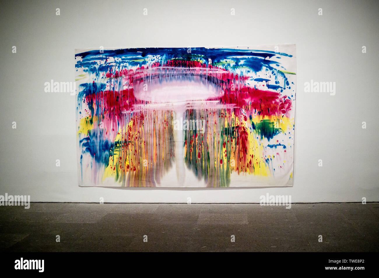 A large Miriam Cahn painting depicting the mushroom cloud of an atom bomb explosion in bright vibrant colours hung in the Museo Nacional Centro de Art Stock Photo