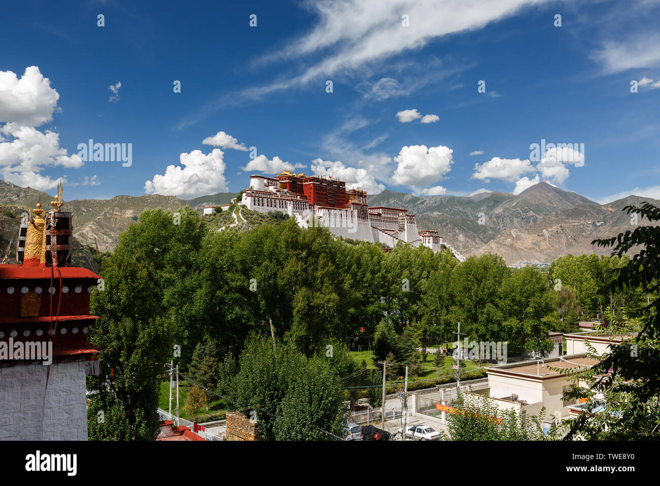 Panorama of Potala Palace - home of the Dalai Lama and Unesco World Heritage. Blue sky, clouds. View of ancient fortress. Center of Tibetan Buddhism Stock Photo