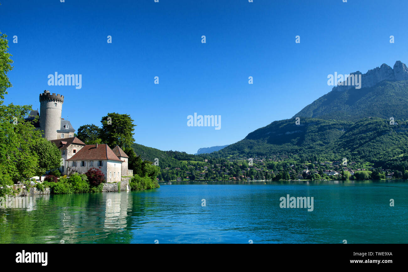a medieval castle on Annecy lake in Alpes mountains, France Stock Photo ...
