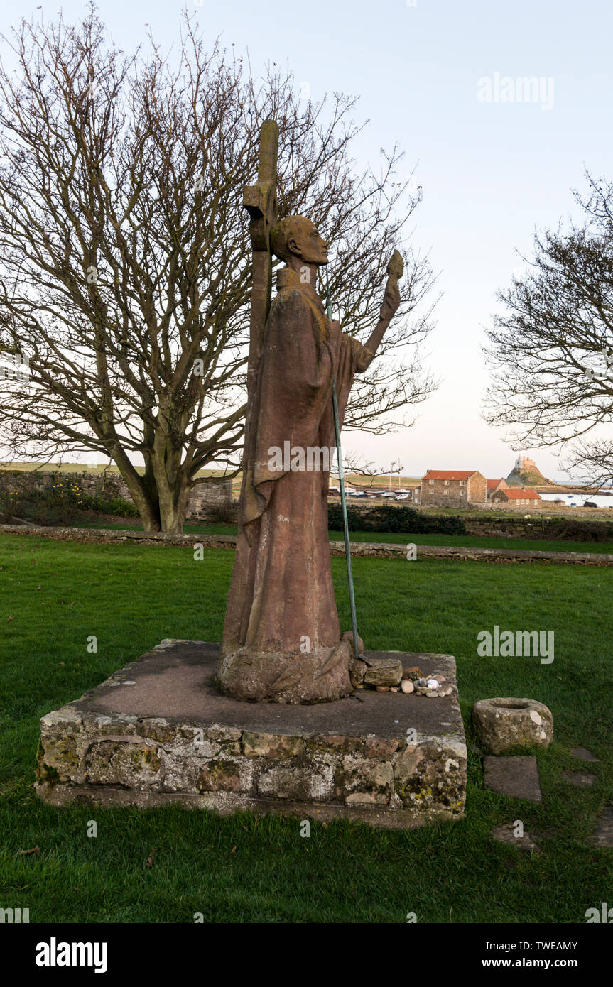 The statue of Saint. Aidan was erected in his honour on Lindisfarne Priory on Holy Island (Lindisfarne) in Northumberland, Britain.  Holy Island is Stock Photo