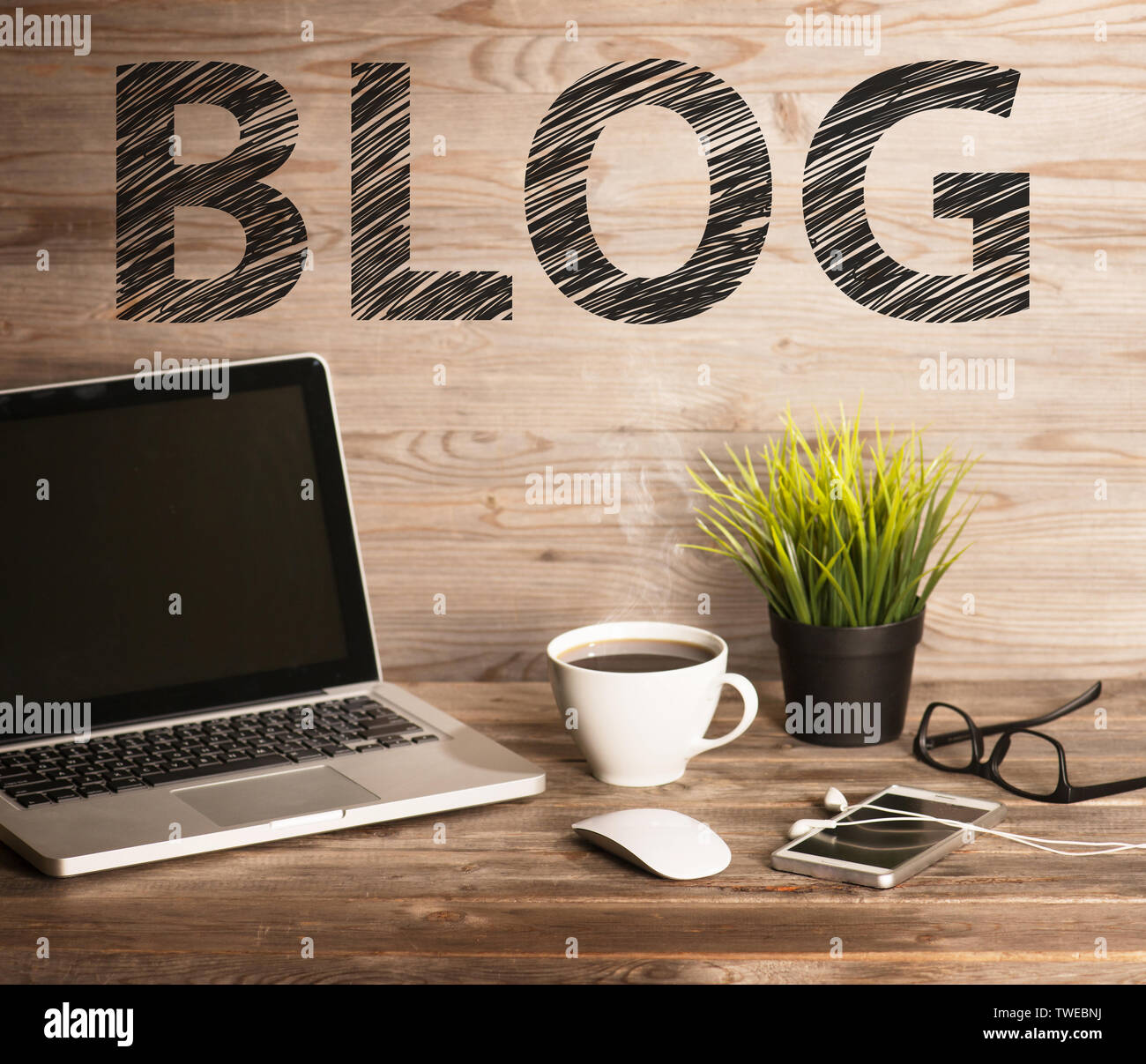 Blog text with computer keyboard, cup of coffee and plant pot. Wooden ...