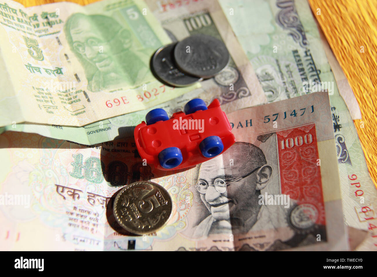 Toy car with Indian banknotes Stock Photo