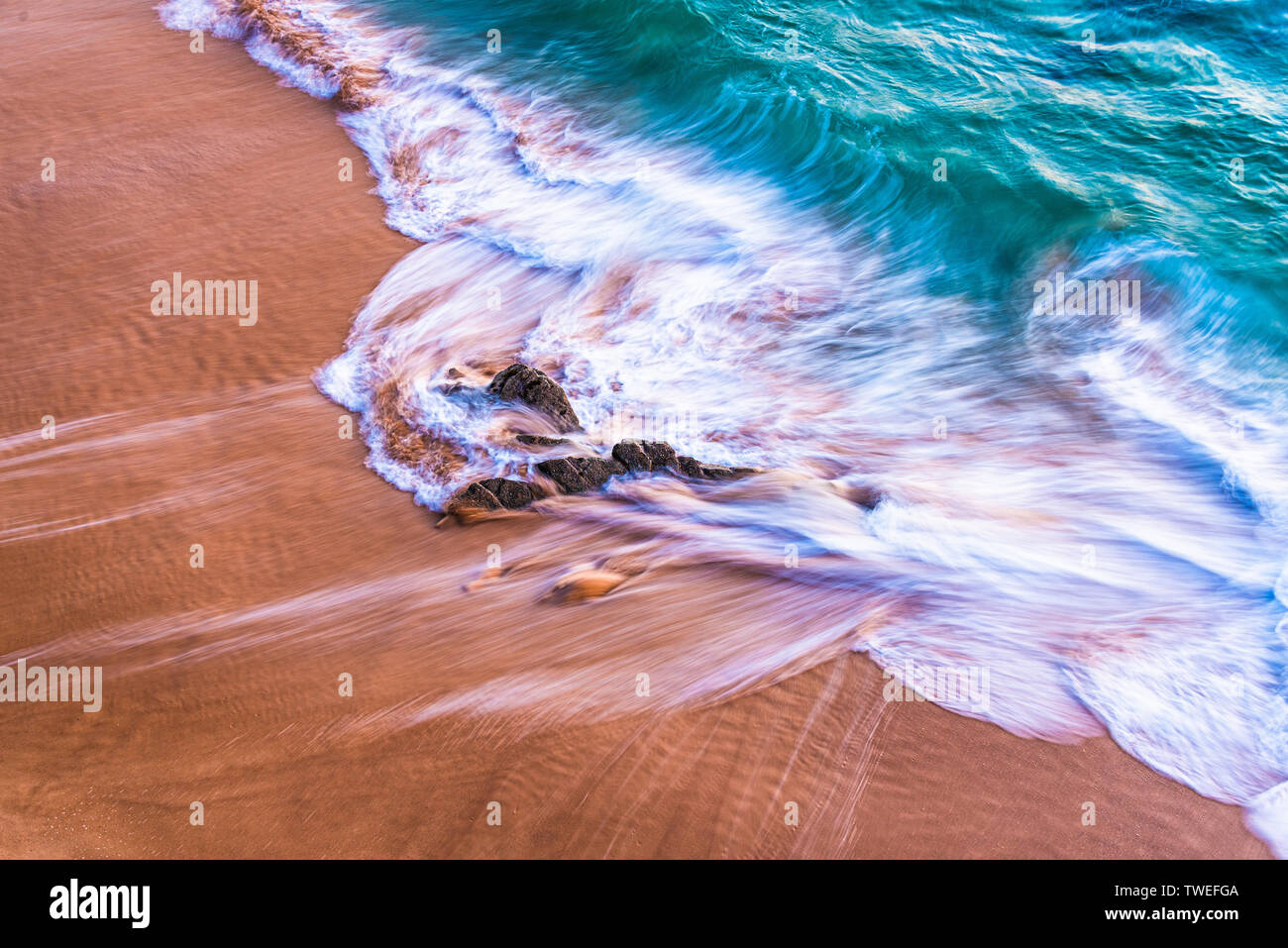 Atlantic sandy shore with blue crashing waves Stock Photo