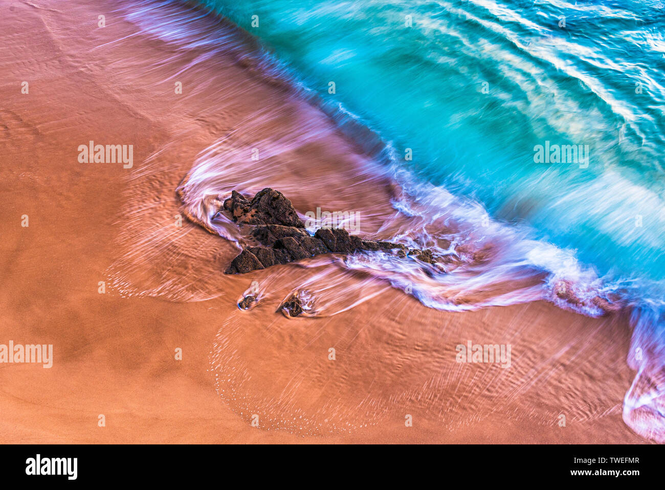 Atlantic sandy shore with blue crashing waves Stock Photo