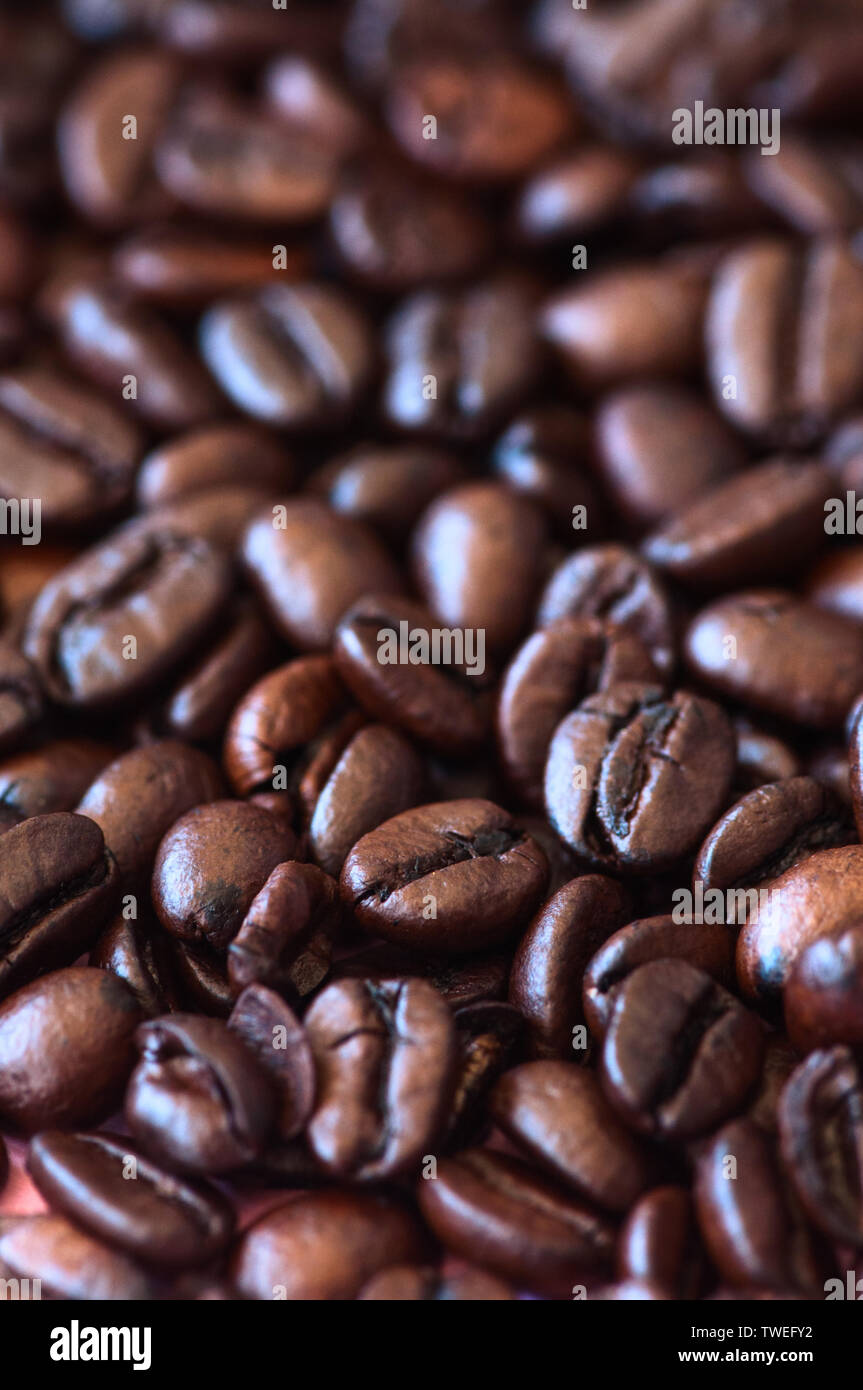 Roasted dark coffee beans background. Close up. Macro Stock Photo - Alamy
