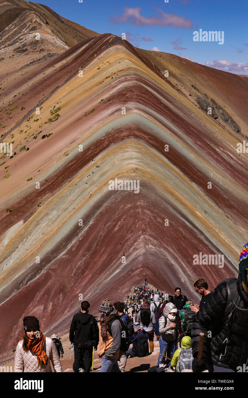 02 May 2019, Peru, Cusco: The Vinicunca, or the Rainbowmontain with an altitude of 5200 meters above zero, is located in the south of Peru and is increasingly developing into a tourist hotspot for day trippers from nearby Cusco. Only a few years ago the mountain was covered with snow and ice. Now the seven colours attract tourists from all over the world like a magnet. The Vinicunca is in the process of losing the rank in the tourist attraction Machu Picchu. The best view of Vinicunca is from the opposite mountain at 5340 metres above sea level. Photo: Tino Plunert/dpa-Zentralbild/ZB Stock Photo