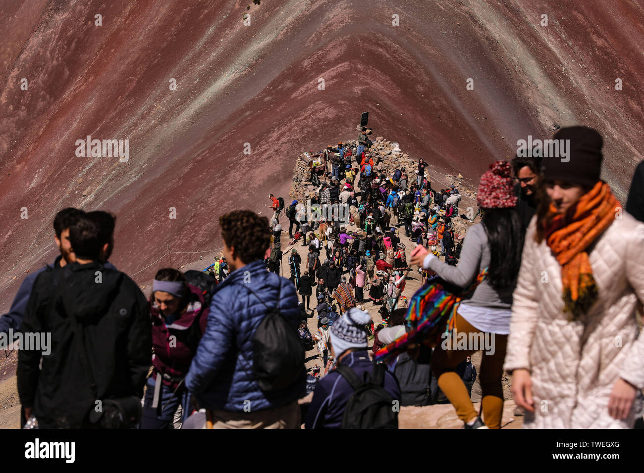 02 May 2019, Peru, Cusco: The Vinicunca, or the Rainbowmontain with an altitude of 5200 meters above zero, is located in the south of Peru and is increasingly developing into a tourist hotspot for day trippers from nearby Cusco. Only a few years ago the mountain was covered with snow and ice. Now the seven colours attract tourists from all over the world like a magnet. The Vinicunca is in the process of losing the rank in the tourist attraction Machu Picchu. The best view of Vinicunca is from the opposite mountain at 5340 metres above sea level. Photo: Tino Plunert/dpa-Zentralbild/ZB Stock Photo