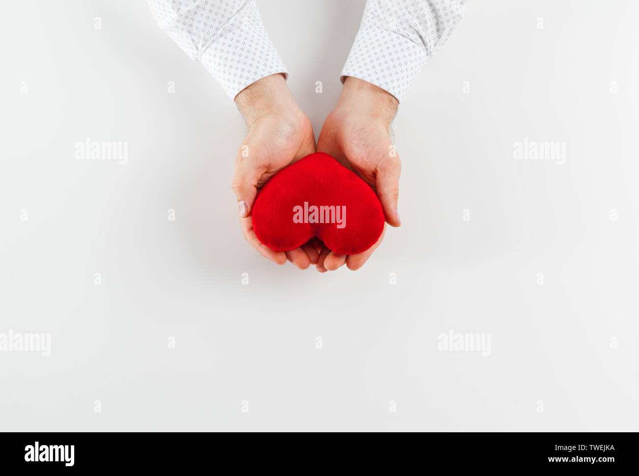 Red heart in girl hand isolate on white background Stock Photo - Alamy