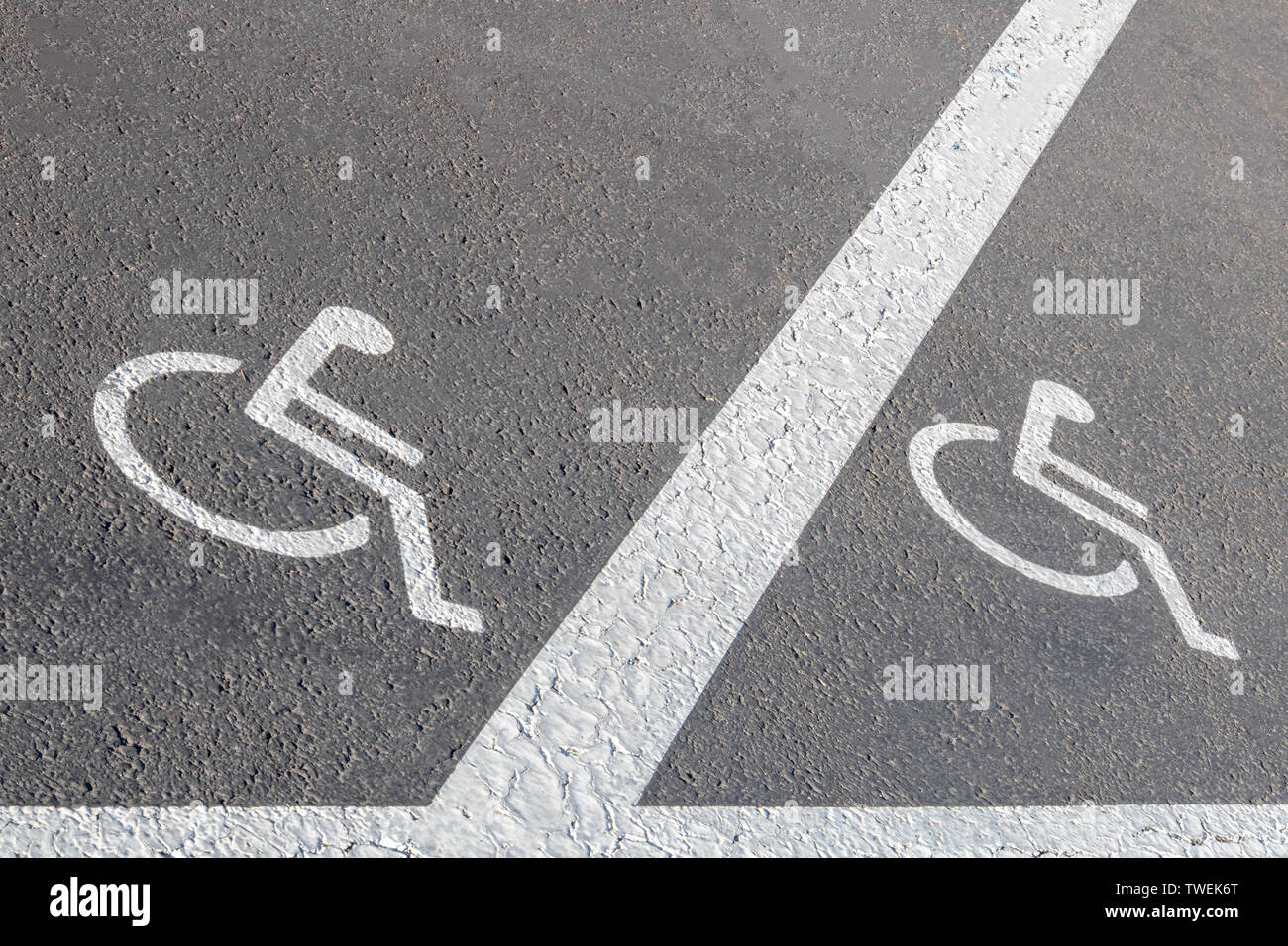 Road marking, road signs reserved parking for persons with reduced mobility Stock Photo