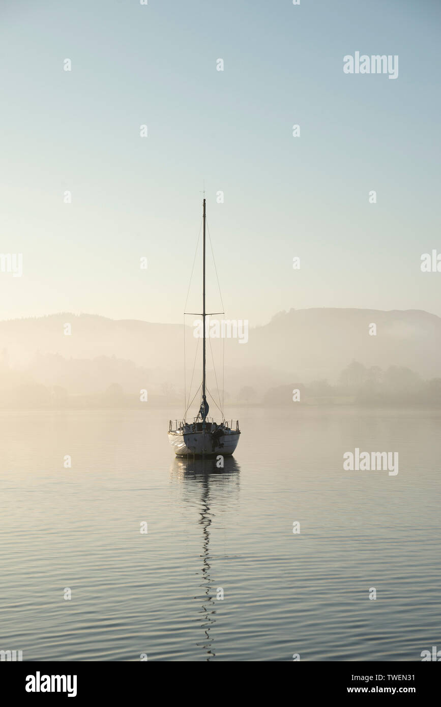 Beautiful unplugged landscape image of sailing yacht sitting still in