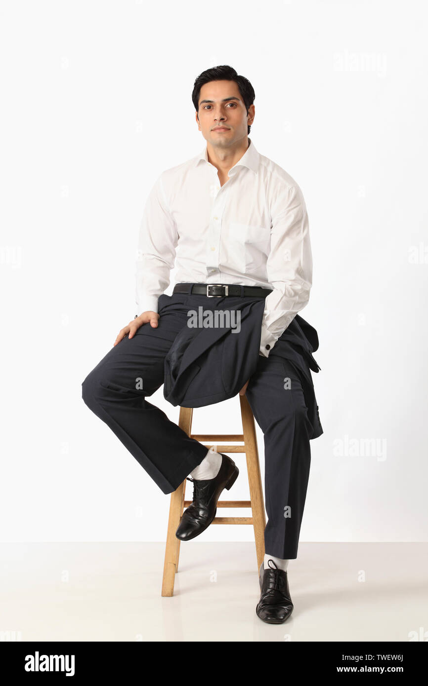 Employee sitting on stool hi-res stock photography and images - Alamy