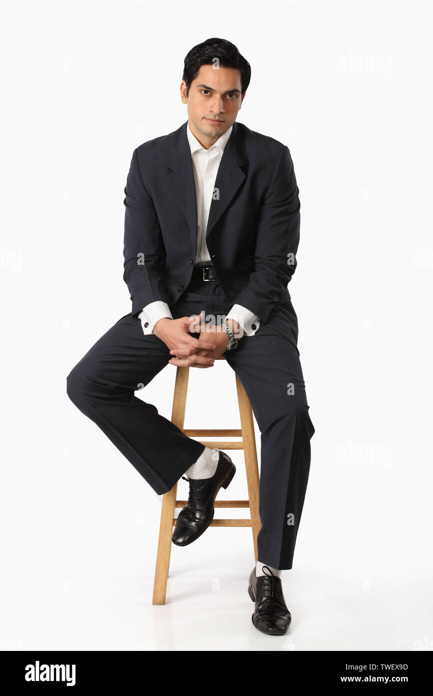 Employee sitting on stool hi-res stock photography and images - Alamy