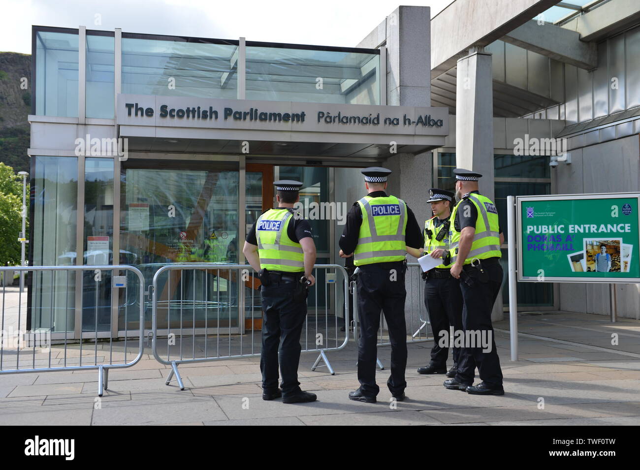 Edinburgh, UK. 20th June, 2019. PICTURED: Police presence outside the Scottish Parliament due to a planned mass protest of the extinction rebellion. Weekly session of First Ministers Questions in the chamber at the Scottish Parliament, Edinburgh. Credit: Colin Fisher/Alamy Live News Stock Photo