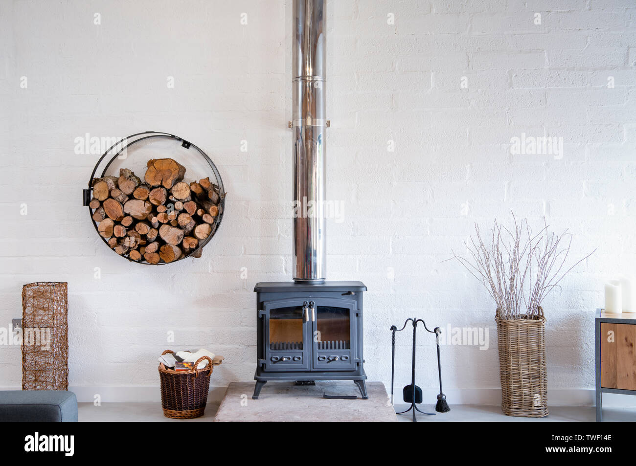 A wood burning stove in a modern barn conversion in the UK Stock Photo -  Alamy