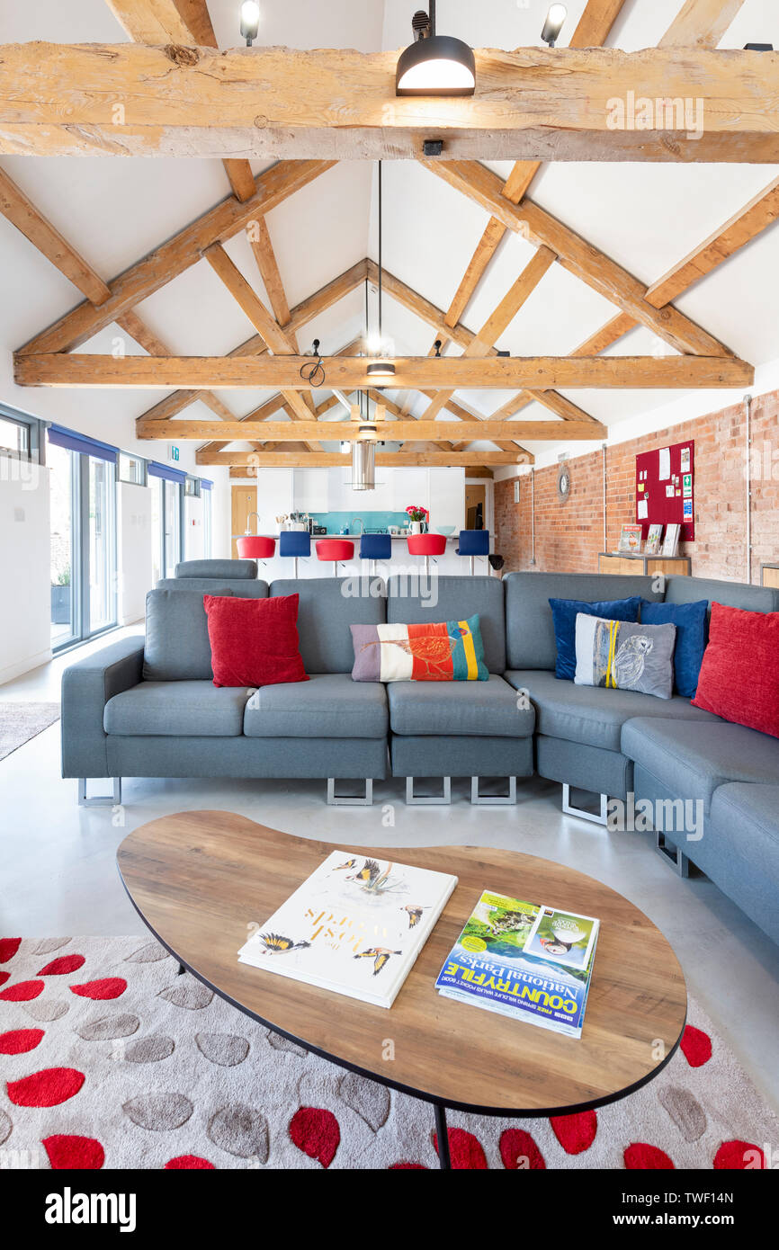 The Lounge Area Of An Open Plan Modern Barn Conversion With High