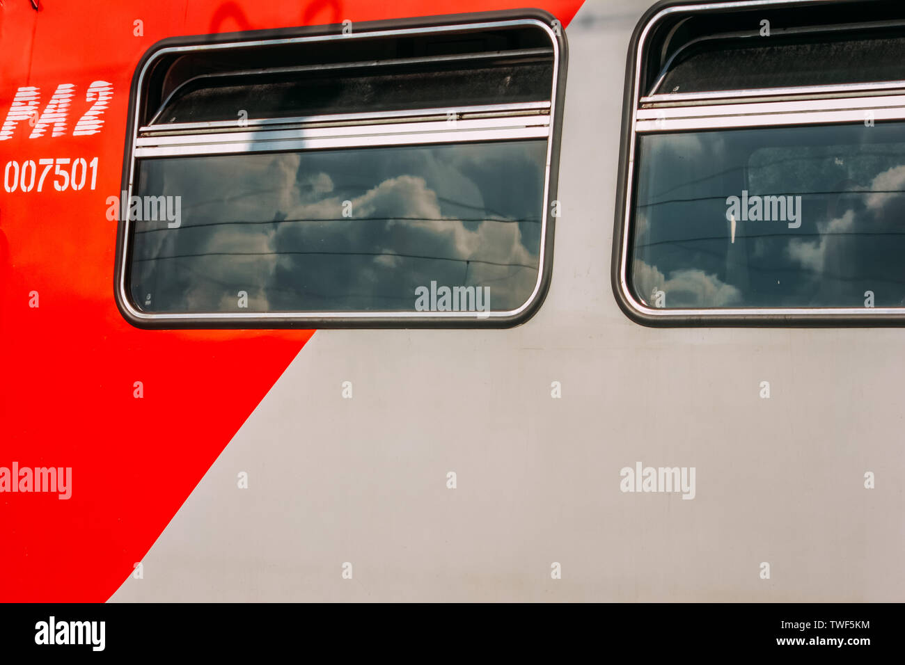 20.06.2019 Bryansk. Russia.Two Windows of the red sleeping car. Stock Photo
