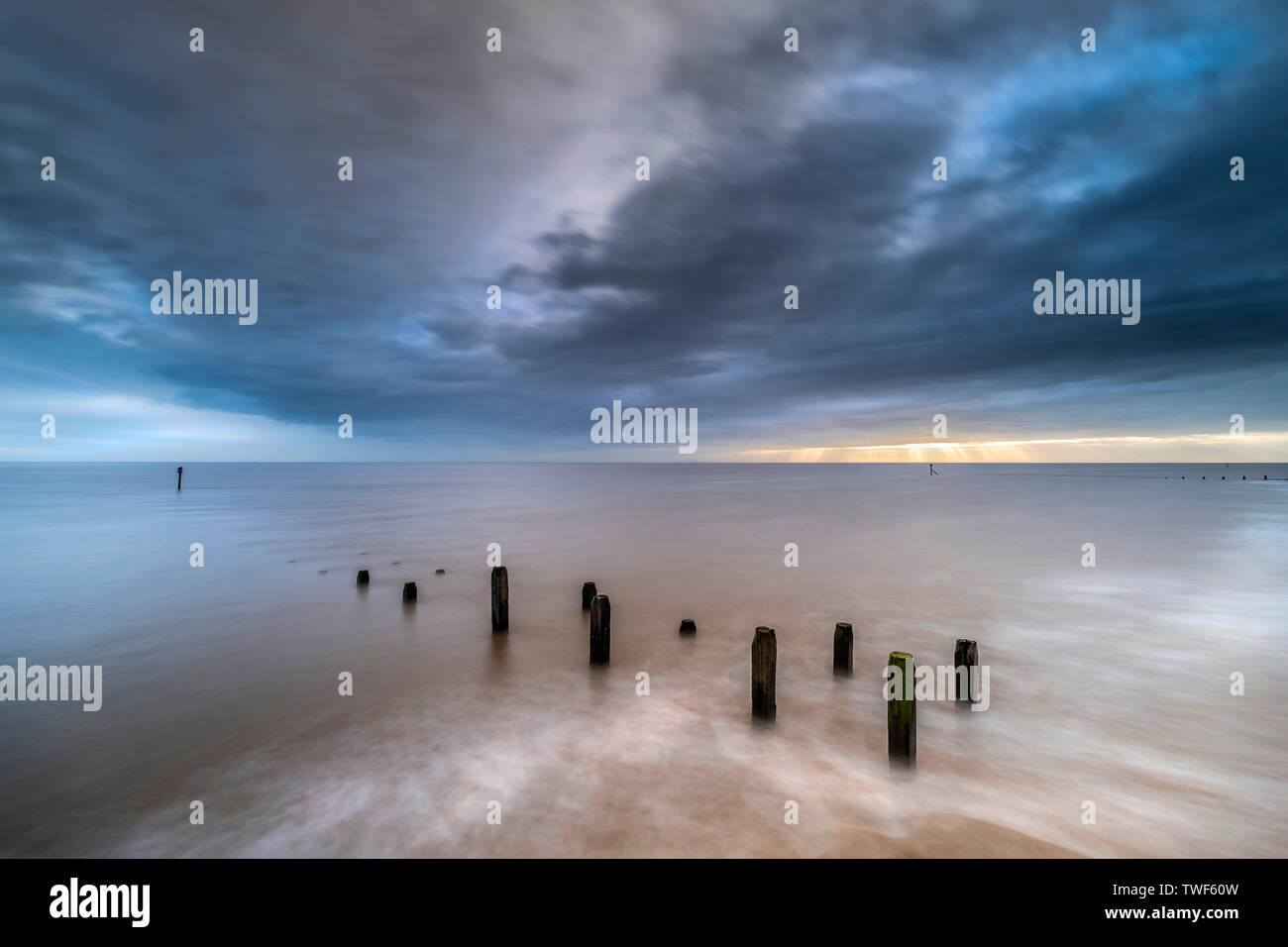 The sea defences at Overstrand on the North Norfolk coast at sunrise. Stock Photo