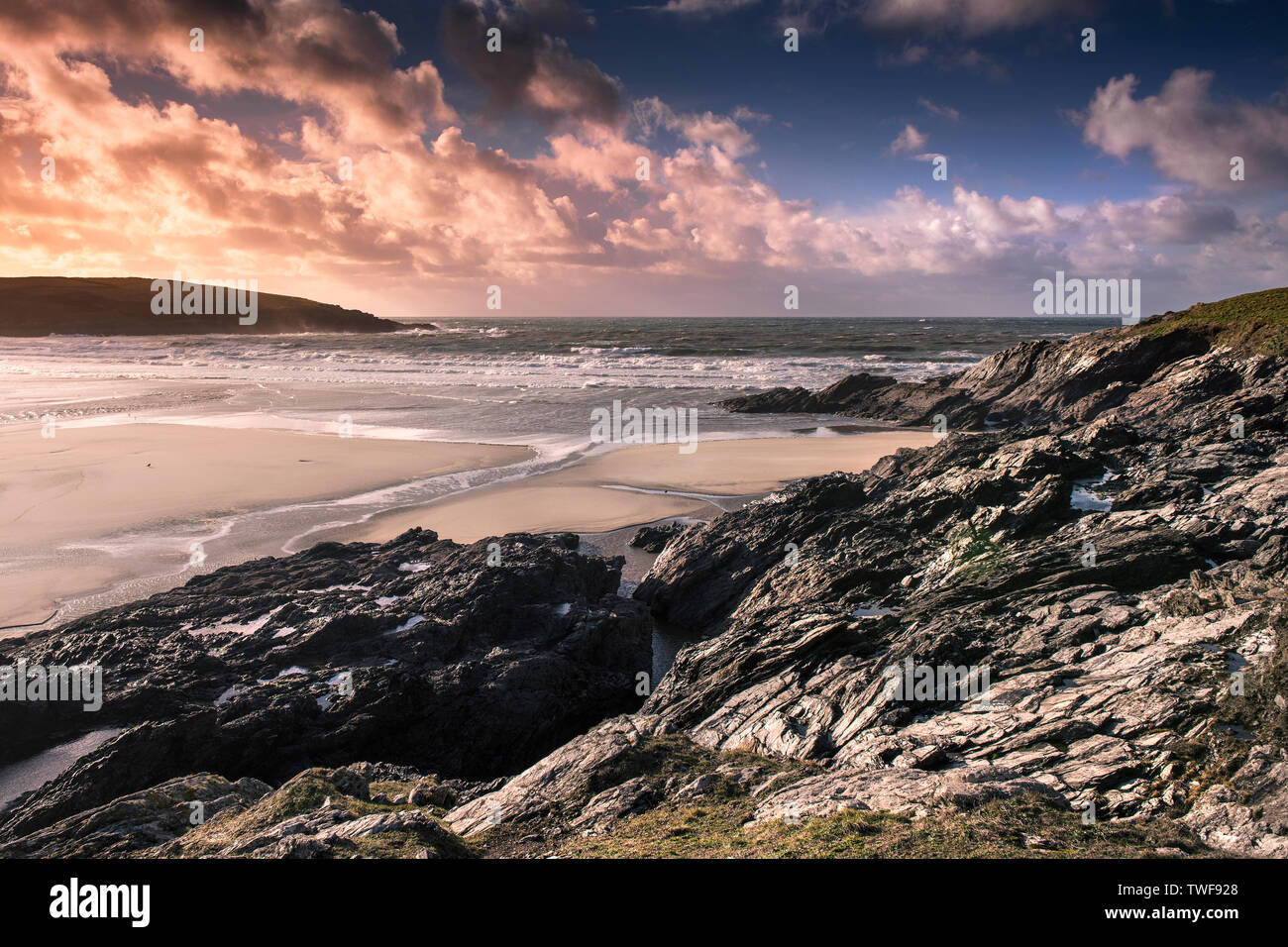 A spectacular sunset over Crantock Beach at low tide in Newquay in Cornwall. Stock Photo