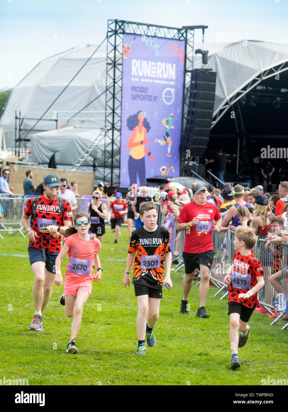 Young runners near the finishing line at Chris Evan’s Run Fest Run event at Bowood House near Chippenham UK Stock Photo