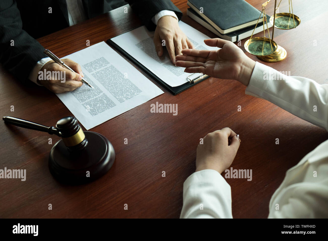 Lawyer working with contract client on the table in office. consultant