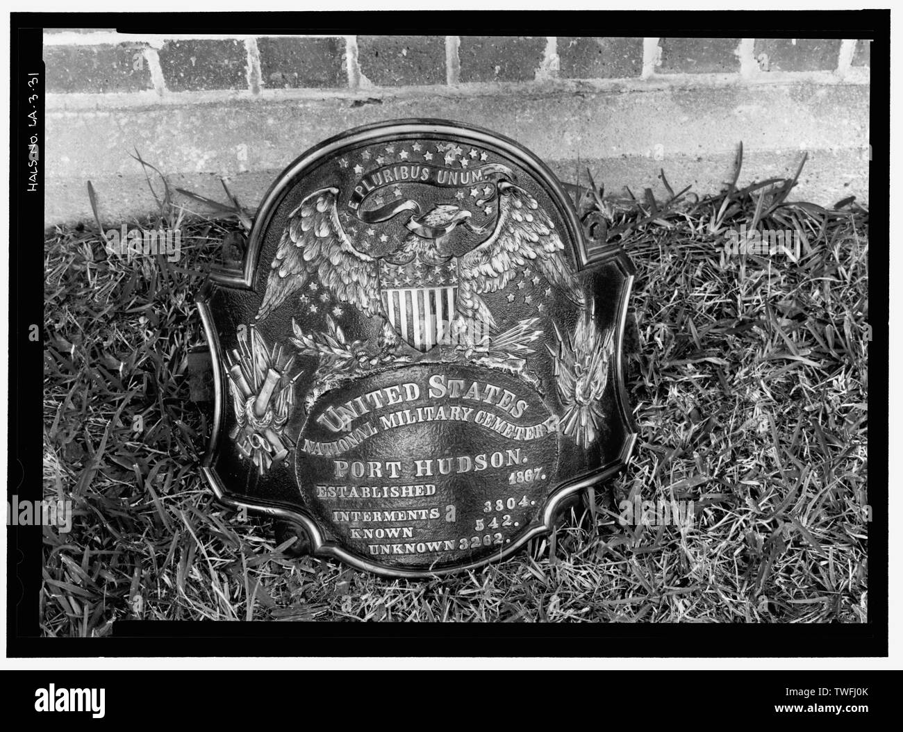 PORT HUDSON NATIONAL CEMETERY PLAQUE, FORMERLY MOUNTED AT BASE OF FLAGPOLE, PRESENTLY STORED IN SERVICE BUILDING. VIEW TO WEST. - Port Hudson National Cemetery, 20978 Port Hickey Road, Zachary, East Baton Rouge Parish, LA; U.S. Department of Veterans Affairs Stock Photo